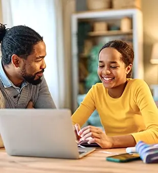 Downloaded father child home family homework daughter girl cheerful teenage parent education laptop teen teaching childhood man learning together school computer internet teacher tutor black