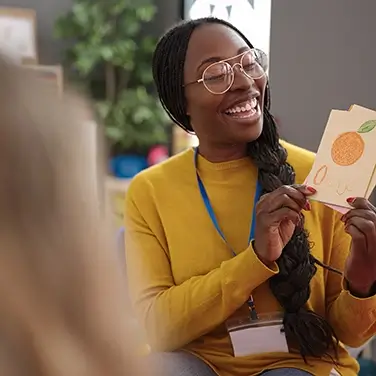 African woman preschool teacher on a vocabulary lesson at kindergarten