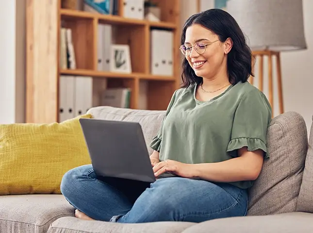 Sofa, laptop and woman using online banking. Computer, information or knowledge of young person on couch and website